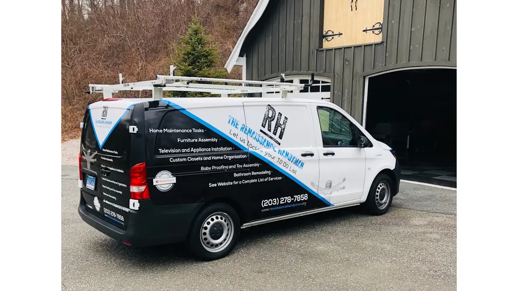 The Renaissance Handyman company van, wrapped with the service list and phone number, parked outside a garage in Old Saybrook